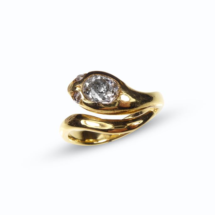 Cushion cut diamond and gold snake crossover ring | MasterArt